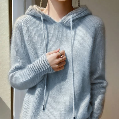 Light blue cashmere-mink blend hoodie with ribbed trim, long sleeves, and a soft draped silhouette.