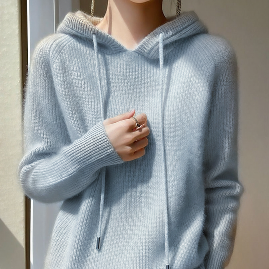 Light blue cashmere-mink blend hoodie with ribbed trim, long sleeves, and a soft draped silhouette.