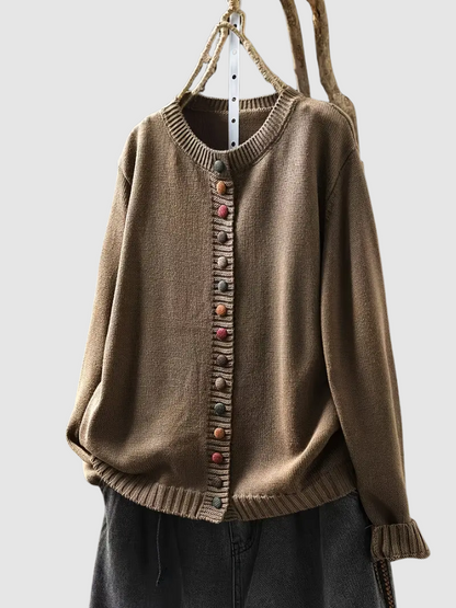 Brown knitted cardigan with colorful buttons on a white background